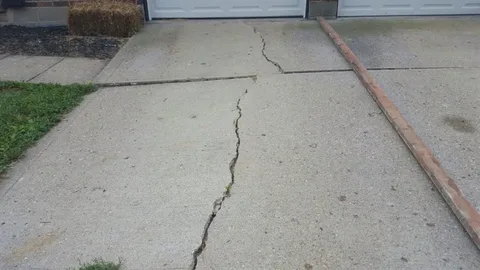 How to Repair Cracks in a Concrete Driveway